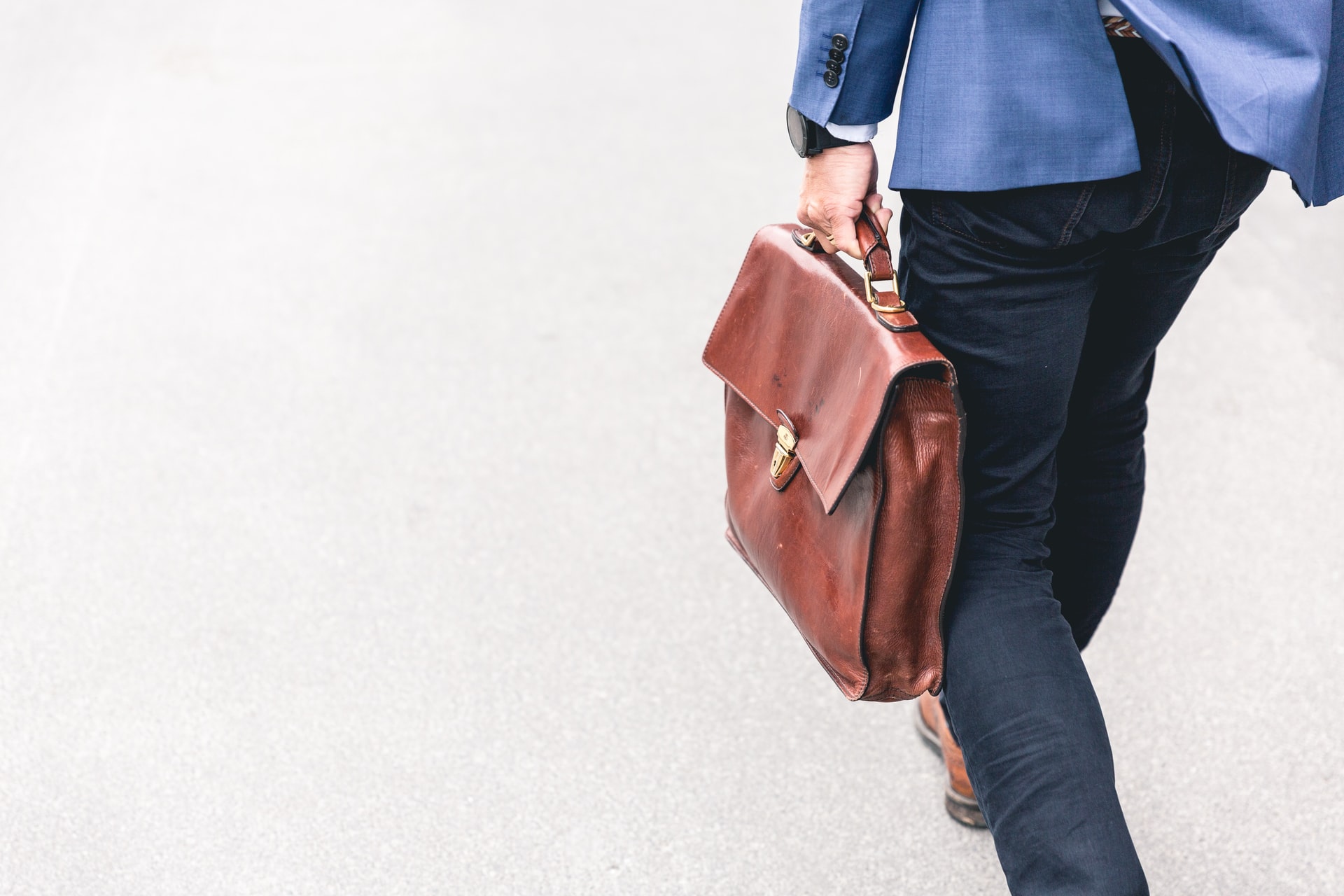 businessperson walking with briefcase