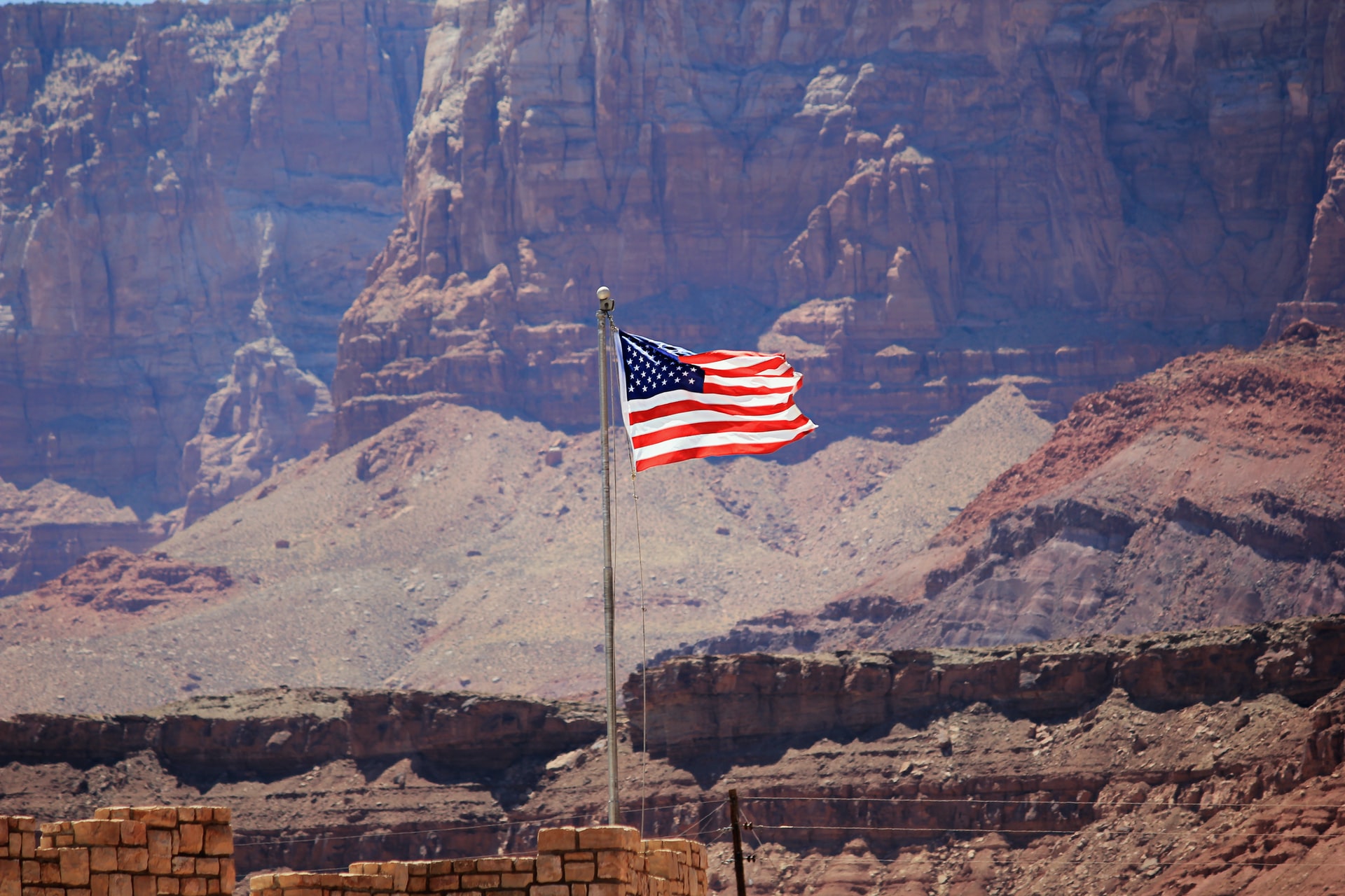 american flag in a canyon